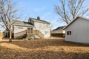 Back of property featuring a deck