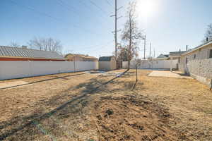 View of yard with a storage shed and a patio area