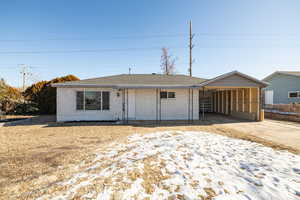 Single story home with a carport