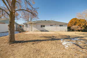 Back of property with a patio