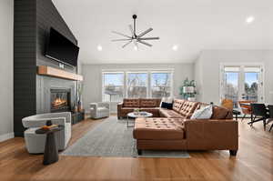 Living room featuring a fireplace and light hardwood / wood-style floors