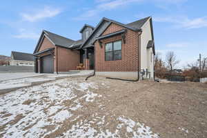 View of front facade featuring a garage