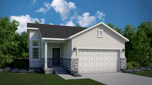 View of front of house with a garage and a front yard