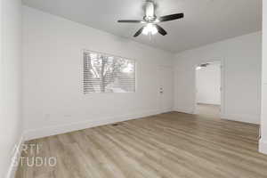 Empty room featuring ceiling fan and light hardwood / wood-style floors