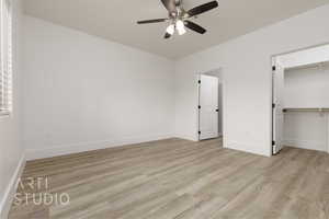 Unfurnished bedroom featuring light hardwood / wood-style flooring, a closet, and ceiling fan