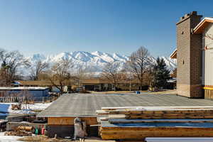 Flat roof of garage. Could be patio. Exterior space featuring a mountain view