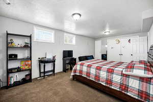 Bedroom 3. Carpeted bedroom featuring a textured ceiling