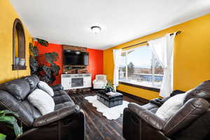 Living room with dark hardwood / wood-style flooring