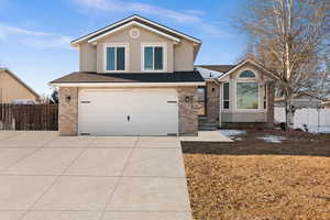 View of front of property featuring a garage