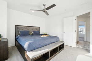 Bedroom featuring ceiling fan and light colored carpet