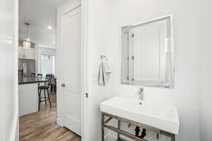 Bathroom featuring sink and hardwood / wood-style floors