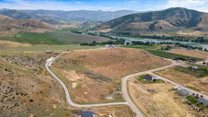 Aerial view with a water and mountain view and a rural view