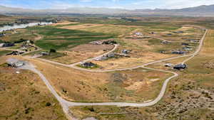 Aerial view with a water and mountain view and a rural view