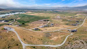 Drone / aerial view featuring a water and mountain view and a rural view