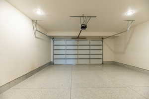 Garage featuring a garage door opener