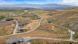 Birds eye view of property featuring a mountain view and a rural view