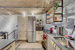 Kitchen with sink, stainless steel appliances, and rail lighting