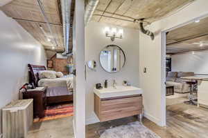 Bathroom featuring vanity and concrete flooring