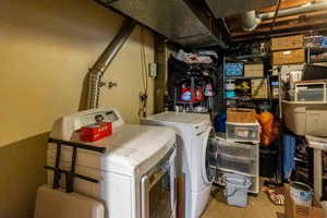 Laundry area featuring separate washer and dryer