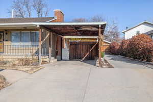 Exterior space featuring a carport