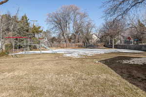 View of yard with a playground