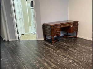 Unfurnished room with dark hardwood / wood-style flooring