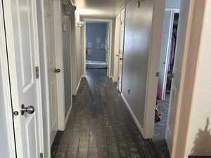 Hallway featuring dark hardwood / wood-style flooring