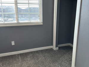 Unfurnished bedroom featuring carpet floors and a closet