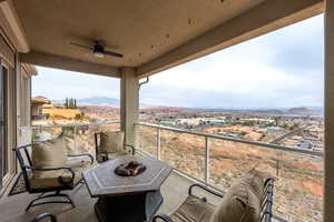 Balcony with a mountain view and an outdoor fire pit