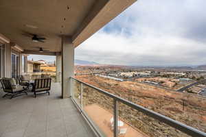 Balcony featuring ceiling fan and a mountain view