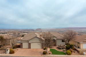 Ranch-style house featuring a mountain view and a garage