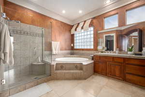 Bathroom featuring vanity, tile patterned floors, and plus walk in shower