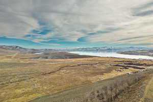 Exterior space featuring a water and mountain view