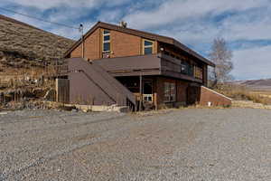 Back of house featuring a mountain view