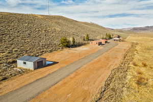 Birds eye view of property featuring a rural view and a mountain view