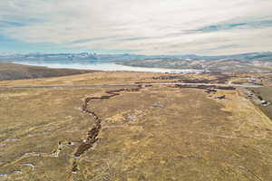 Drone / aerial view with a water and mountain view