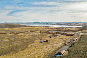 Aerial view featuring a water and mountain view