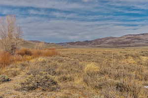 Property view of mountains with a rural view