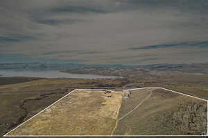 Drone / aerial view with a water and mountain view