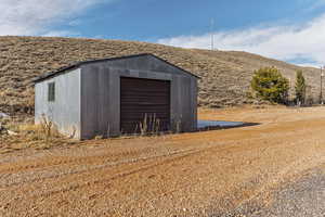 View of outbuilding with a garage