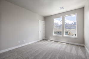 Unfurnished room with carpet flooring