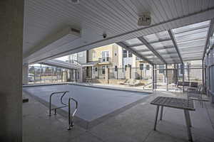 View of swimming pool featuring a patio