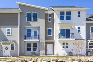 View of front of home with central AC unit