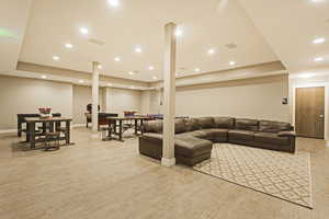 Living room with light hardwood / wood-style flooring