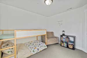 View of carpeted bedroom