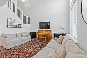 Living room featuring a towering ceiling