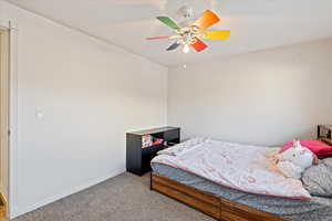 Bedroom with carpet and ceiling fan