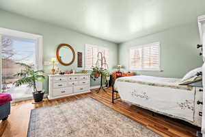 Bedroom with light hardwood / wood-style floors