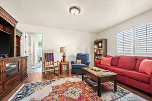 Living room featuring dark hardwood / wood-style flooring