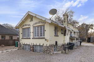 View of side of home with a mountain view